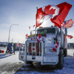 
              The last truck blocking the southbound lane moves after a breakthrough resolved the impasse where anti-COVID-19 vaccine mandate demonstrators blocked the highway at the busy U.S. border crossing in Coutts, Alberta, Wednesday, Feb. 2, 2022. (Jeff McIntosh /The Canadian Press via AP)
            