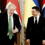 
              Britain's Prime Minister Boris Johnson, left, reacts with Ukrainian President Volodymyr Zelenskyy, prior to their talks amid rising tension between Ukraine and Russia, at the presidential palace, in Kyiv, Ukraine, Tuesday, Feb. 1, 2022.  (Peter Nicholls/Pool Photo via AP)
            