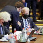 
              FILE - French President Emmanuel Macron, center, speaks with U.S. President Joe Biden, right, and British Prime Minister Boris Johnson during a NATO summit in Brussels, June 14, 2021. France and the United Kingdom are nuclear powers with a might still somewhat redolent of their imperial past. But for all so many nations, defense spending felt like too high a burden as they sought to re-emerge from World War II. (AP Photo/Olivier Matthys, File)
            