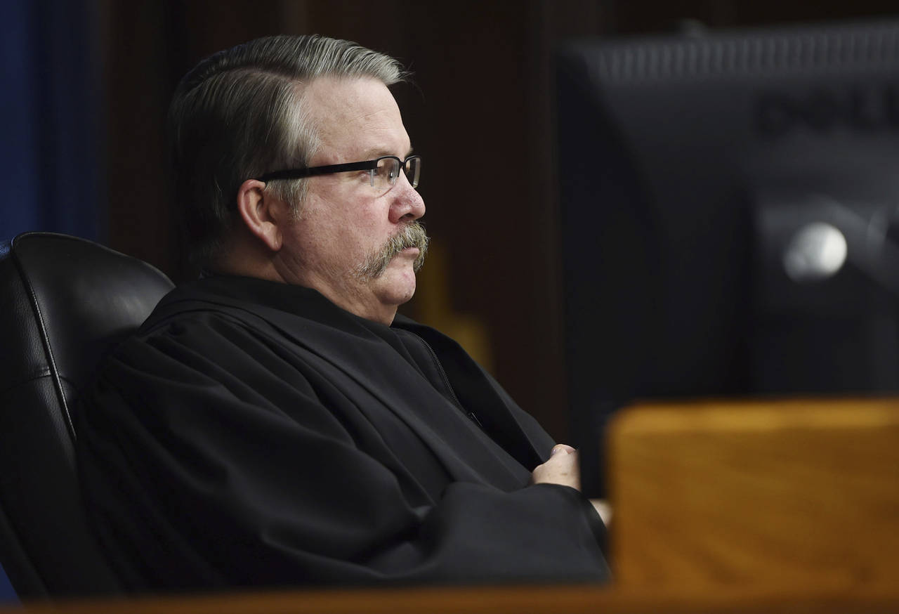 Jackson County Circuit Court Judge John McBain presides over a murder trial at the Jackson County C...