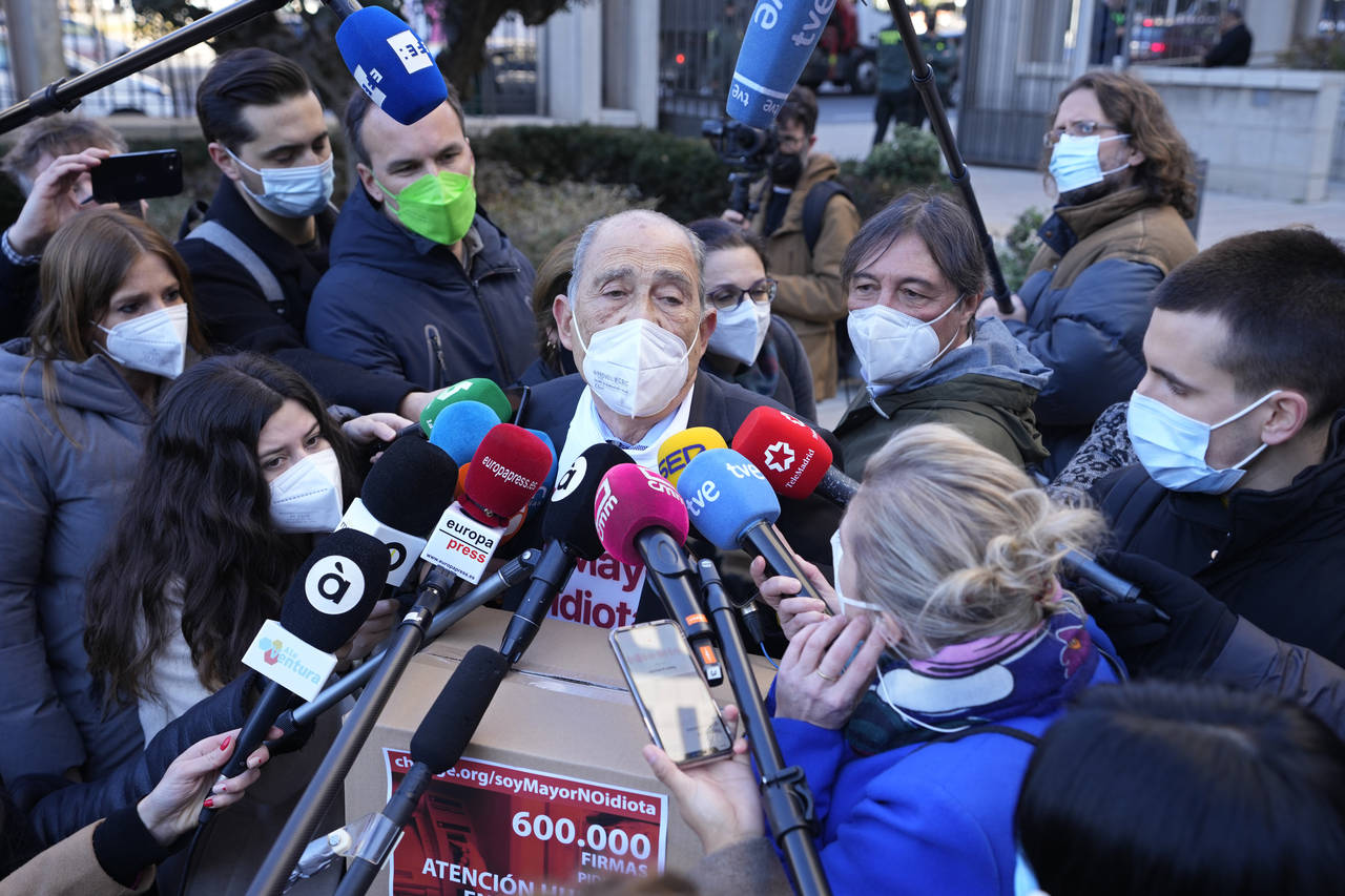 Carlos San Juan, 78, a Spanish retiree speaks with the press outside the Economy Ministry in Madrid...