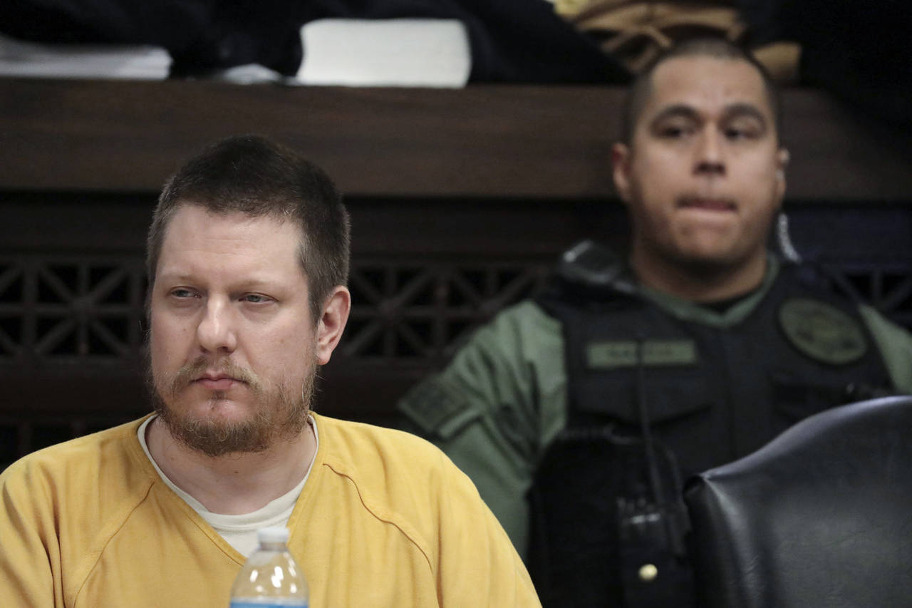 FILE - Chicago police Officer Jason Van Dyke, left, attends his sentencing hearing at the Leighton ...