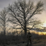 
              A Ukrainian serviceman walks to a frontline position outside Popasna, in the Luhansk region, eastern Ukraine, Sunday, Feb. 20, 2022. Russia extended military drills near Ukraine's northern borders Sunday amid increased fears that two days of sustained shelling along the contact line between soldiers and Russia-backed separatists in eastern Ukraine could spark an invasion. Ukraine's president appealed for a cease-fire. (AP Photo/Vadim Ghirda)
            