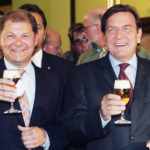 
              File-File Photo shows German Chancellor Gerhard Schroeder, right, drinking a glass of beer with Social Democratic member of German parliament Olaf Scholz during their visit to the Holsten brewery in Hamburg, northern Germany on Wednesday, Aug. 3, 2005. German Chancellor Olaf Scholz is flying to Washington this week on a mission to reassure Americans that his country stands alongside the United States and other NATO partners in opposing any Russian aggression against Ukraine.(AP Photo/Fabian Bimmer, file)
            