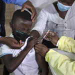 
              FILE - A child reacts as he receives his Pfizer vaccine against COVID-19 in Diepsloot Township near Johannesburg, Thursday, Oct. 21, 2021. Africa's top health official John Nkengasong on Thursday Feb. 3, 2022, is launching a campaign to enlist young people to encourage vaccinations, as just 11.3% of the continent's 1.3 billion people are vaccinated against COVID-19. (AP Photo/Denis Farrell, File)
            