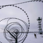 
              A Ukrainian border guard patrols the border with Russia not far from Hoptivka village, Kharkiv region, Ukraine, Wednesday, Feb. 2, 2022. Russian President Vladimir Putin is accusing the U.S. and its allies of ignoring Russia's top security demands but says Moscow is willing to talk more to ease tensions over Ukraine. (AP Photo/Evgeniy Maloletka)
            