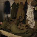 
              A Ukrainian serviceman sleeps after his shift at a frontline position outside Popasna, in the Luhansk region, eastern Ukraine, Sunday, Feb. 20, 2022. Russia extended military drills near Ukraine's northern borders Sunday amid increased fears that two days of sustained shelling along the contact line between soldiers and Russia-backed separatists in eastern Ukraine could spark an invasion. Ukraine's president appealed for a cease-fire. (AP Photo/Vadim Ghirda)
            