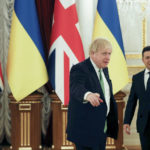 
              Britain's Prime Minister Boris Johnson, second right, gestures with Ukrainian President Volodymyr Zelenskyy, prior to their talks amid rising tension between Ukraine and Russia, at the presidential palace, in Kyiv, Ukraine, Tuesday, Feb. 1, 2022.  (Peter Nicholls/Pool Photo via AP)
            