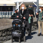 
              People wearing masks stroll in Saint-Jean-de-Luz southwestern France, Wednesday, Fev.2, 2022. England, France, Ireland, the Netherlands and several Nordic countries have taken steps to end or loosen their restrictions. Step by step, many countries are easing their COVID-19 restrictions amid hopes the omicron wave may have passed its peak. (AP Photo/Bob Edme)
            