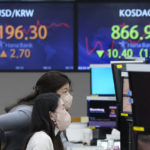 
              Currency traders watch monitors at the foreign exchange dealing room of the KEB Hana Bank headquarters in Seoul, South Korea, Thursday, Feb. 24, 2022. Asian stock markets followed Wall Street lower Thursday as anxiety about a possible Russian invasion of Ukraine rose. (AP Photo/Ahn Young-joon)
            