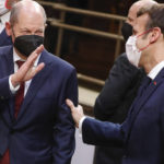 
              FILE - German Chancellor Olaf Scholz, left, and French President Emmanuel Macron speak with each other during an EU Summit in Brussels, Dec. 17, 2021. European Union leaders discussed during the one-day summit Russia's military threat to neighbouring Ukraine. (Stephanie Lecocq, Pool Photo via AP, file)
            