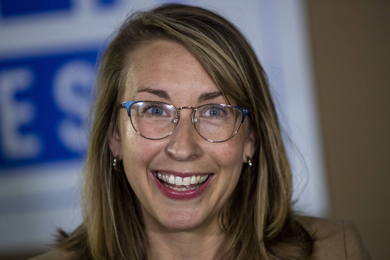 FILE - Democratic congressional candidate Hillary Scholten speaks to members of the media outside K...