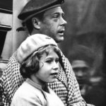 
              FILE - Britain's Princess Elizabeth rides with her uncle, Prince Edward, during a visit to Balmoral, Sctoland, 1933. Queen Elizabeth II will mark 70 years on the throne Sunday, Feb. 6, 2022 an unprecedented reign that has made her a symbol of stability as the United Kingdom navigated an age of uncertainty. Elizabeth, now 95, was expected to live the life of a minor royal when she was born. But everything changed a decade later when her uncle, King Edward VIII, abdicated so he could marry the American divorcee Wallis Simpson. (AP Photo, File)
            