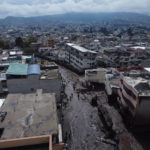 
              A street is filled with mud after a rain-weakened hillside collapsed and brought waves of mud over La Gasca area of Quito, Ecuador, Tuesday, Feb. 1, 2022. (AP Photo/Dolores Ochoa)
            