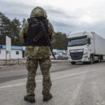 
              A Ukrainian border guard officer stands at the Ukrainian Belarusian state border checkpoint Novi Yarylovychi, Ukraine, Monday, Feb.21, 2022. (AP Photo/Oleksandr Ratushniak)
            