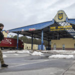 
              A Ukrainian border guard officer in a Ukrainian Belarusian state border checkpoint Novi Yarylovychi, Ukraine, Monday, Feb.21, 2022. (AP Photo/Oleksandr Ratushniak)
            