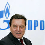 
              File--- File photo shows Former German Chancellor Gerhard Schroeder walking in Russian natural gas monopoly Gazprom headquarters in Moscow, Thursday, March 30, 2006.  German Chancellor Olaf Scholz is flying to Washington this week on a mission to reassure Americans that his country stands alongside the United States and other NATO partners in opposing any Russian aggression against Ukraine.(AP Photo/ Alexander Zemlianichenko, file )
            