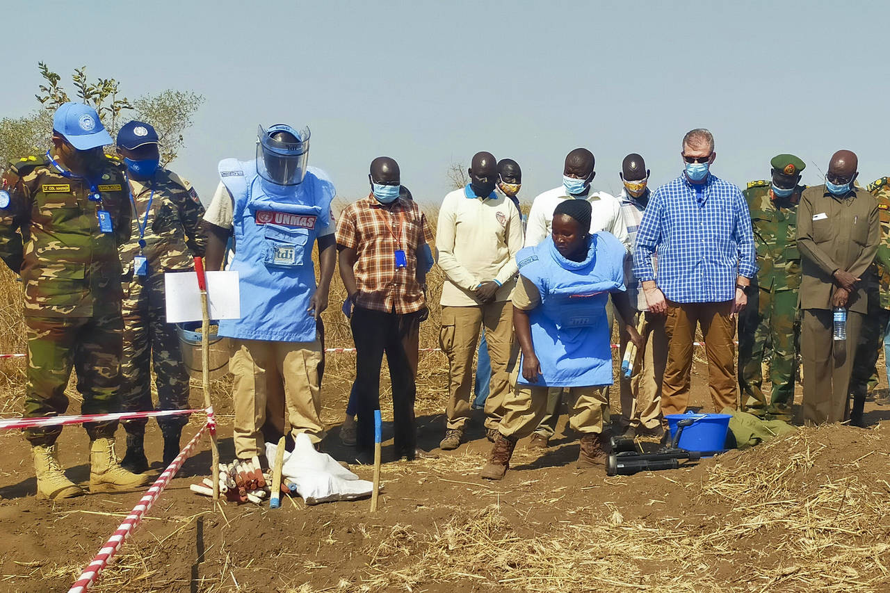 Members of the United Nations Mine Action Service (UNMAS) demonstrate the procedures they use to de...