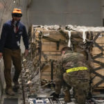 
              In this image provided by the U.S. Air Force, Airmen from the 436th Aerial Port Squadron load ammunition, weapons and other equipment bound for Ukraine during a foreign military sales mission at Dover Air Force Base, Del., on Jan. 30, 2022. Since 2014, the United States has committed more than $5.4 billion in total assistance to Ukraine, including security and non-security assistance. (Senior Airman Stephani Barge/U.S. Air Force via AP)
            