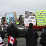 
              Supporters gather near the legislature to protest during a demonstration against COVID-19 restrictions in Victoria, British Columbia, Saturday, Feb. 5, 2022. (Chad Hipolito/The Canadian Press via AP)
            