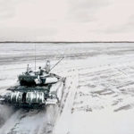 
              In this photo taken from video and released by the Russian Defense Ministry Press Service on Wednesday, Feb. 2, 2022, a tank drives during a Russian and Belarusian joint military drills at Brestsky firing range, Belarus. Russian and Belarus troops held joint combat training at firing ranges in Belarus Wednesday as tensions remain high under the looming threat of war with Ukraine. The drills involved motorized rifle, artillery and anti-tank missile units, as well tanks' and armoured personnel carriers' crews. (Russian Defense Ministry Press Service via AP)
            