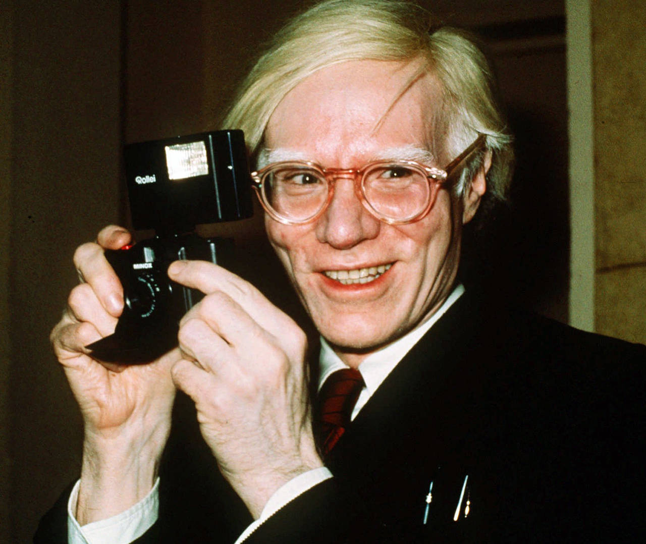 FILE - In this 1976 file photo, pop artist Andy Warhol smiles in New York. The Supreme Court has ag...