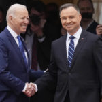 
              U.S. President Joe Biden, left, and Polish President Andrzej Duda shake hands during a military welcome ceremony at the Presidential Palace in Warsaw, Poland, on Saturday, March 26, 2022. (AP Photo/Czarek Sokolowski)
            