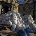 
              Sandbags protect a building entrance in downtown Lviv, western Ukraine, Tuesday, March 22, 2022. Ukrainian forces fought off continuing Russian efforts to occupy Mariupol and claimed to have retaken a strategic suburb of Kyiv on Tuesday, mounting a defense so dogged that it is stoking fears Russia's Vladimir Putin will escalate the war to new heights. (AP Photo/Bernat Armangue)
            