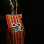 
              The President of the Metis community, Cassidy Caron shows a scarf she will wear with a meeting with Pope Francis in Rome, Monday, March 28, 2022. A Canadian indigenous delegations is scheduled to have a week of meetings with Pope Francis at the Vatican. (AP Photo/Gregorio Borgia)
            