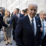 
              President Joe Biden walks with British Prime Minister Boris Johnson, right, at NATO Headquarters in Brussels, Thursday, March 24, 2022. (Brendan Smialowski, Pool via AP)
            