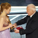 
              Anthony Hopkins, right, presents Jessica Chastain with the award for best performance by an actress in a leading role for "The Eyes of Tammy Faye" at the Oscars on Sunday, March 27, 2022, at the Dolby Theatre in Los Angeles. (AP Photo/Chris Pizzello)
            