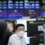 
              Currency traders watch monitors at the foreign exchange dealing room of the KEB Hana Bank headquarters in Seoul, South Korea, Thursday, March 31, 2022. Asian stock markets sank Thursday after Chinese manufacturing weakened and Russian shelling around Ukraine's capital shook hopes of progress in peace talks. (AP Photo/Ahn Young-joon)
            