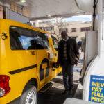 
              Taxi driver Marc Dussuau fuels his cab at the Shell gas station on Friday, March 25, 2022, in New York. With fuel prices approaching $5 a gallon at some New York City gas stations, drivers for Uber and Lyft and the city's taxi fleets are demanding rate surcharges to help offset the rising cost of keeping cars on the road.  (AP Photo/Brittainy Newman)
            