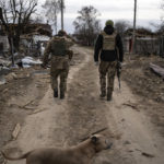 
              Ukrainian soldiers walk near the front line in Brovary, on the outskirts of Kyiv, Ukraine, Monday, March 28, 2022. (AP Photo/Rodrigo Abd)
            