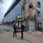 
              Mayor of Chernihiv Vadyslav Atroshenko, right, speaks to a journalist near the shopping mall damaged by night shelling in Chernihiv, Ukraine, Wednesday, March 30, 2022. Ukrainian officials say Russian forces pounded areas around Kyiv and another Ukrainian city overnight. The attacks come hours after Moscow pledged to scale back military operations in those places.(AP Photo/Vladislav Savenok)
            