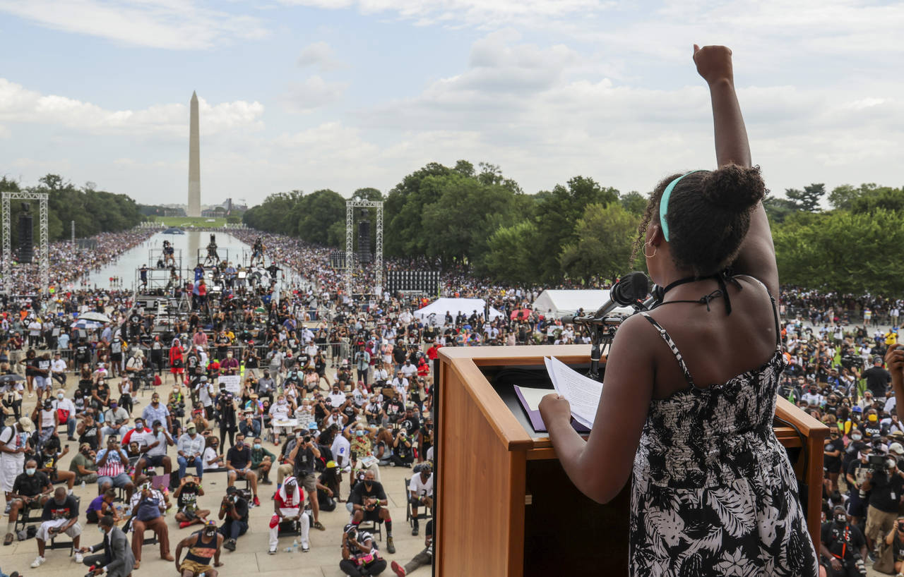 FILE - Yolanda Renee King, granddaughter of The Rev. Martin Luther King Jr., raises her fist as she...