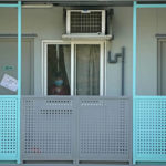 
              FILE - A woman looks out of the window of an isolation unit at the Penny's Bay Quarantine Centre on Lantau Island, in Hong Kong, Thursday, Feb. 24, 2022. Hong Kong's leader Carrie Lam on Monday, March 21, 2022, said that the city would lift flight bans on countries including Britain and the U.S., as well as reduce quarantine for travelers arriving in the city as coronavirus infections in its latest outbreak plateaus. (AP Photo/Kin Cheung, File)
            