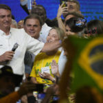 
              Brazil's President Jair Bolsonaro speaks during an event with members of his Liberal Party and with supporters in Brasilia, Brazil, Sunday, March 27, 2022. (AP Photo/Eraldo Peres)
            