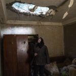 
              Halyna Falko looks at the destruction caused after a Russian attack inside her house near Brovary, on the outskirts of Kyiv, Ukraine, Monday, March 28, 2022. (AP Photo/Rodrigo Abd)
            