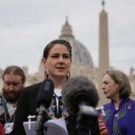 
              President of the Metis community, Cassidy Caron, speaks to the media in St. Peter's Square after their meeting with Pope Francis at The Vatican, Monday, March 28, 2022. (AP Photo/Gregorio Borgia)
            