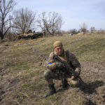 
              A Ukrainian soldier guards a position next to destroyed Russian tank near the front line in Brovary, on the outskirts of Kyiv, Ukraine, Monday, March 28, 2022. (AP Photo/Rodrigo Abd)
            