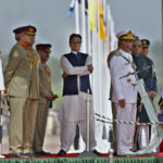 
              Pakistan's Prime Minister Imran Khan, center, and top military officials attend a military parade to mark Pakistan National Day in Islamabad, Pakistan, Wednesday, March 23, 2022. Pakistanis celebrated their National Day on Wednesday with a military parade in the capital, Islamabad, showcasing this Islamic nation's elite army units and high-tech weaponry, including short, medium, and long-range missiles, tanks, fighter jets and other hardware. (Anjum Naveed)
            