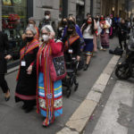 
              The President of the Metis community, Cassidy Caron, left, leaves the hotel with a Metis National Council delegation to meet with Pope Francis in Rome, Monday, March 28, 2022. A Canadian indigenous delegations is scheduled to have a week of meetings with Pope Francis at the Vatican. (AP Photo/Gregorio Borgia)
            