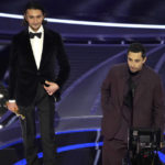 
              Aneil Karia, left, and Riz Ahmed accept the award for best live action short for "The Long Goodbye" at the Oscars on Sunday, March 27, 2022, at the Dolby Theatre in Los Angeles. (AP Photo/Chris Pizzello)
            