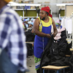 
              Women work in a garment factory in Maseru, Lesotho, Thursday, Feb. 24, 2022. When the coronavirus pandemic hit the world two years ago, the global fashion industry crumpled when faced with collapsing demand, brands canceled orders worth billions of dollars and few felt the effects so harshly as the tens of millions of workers, most of them women, who stitched the world's clothes. (AP Photo/Neo Ntsoma)
            