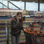 
              Alina Slobodianiuk, 41, from Dnipro, speaks by phone in a supermarket in the village of Guissona, Lleida, Spain, Tuesday, March 22, 2022. Long before Russian tanks rolled into Ukraine, the tiny town of Guissona was known as "Little Ukraine" – one in seven residents were originally from the country, most of them lured to this northeastern Spanish town by jobs at a supermarket distribution hub. (AP Photo/Joan Mateu Parra).
            