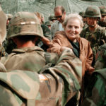 
              FILE - U.S. Secretary of State Madeleine Albright greets US Soldiers at Bondsteel camp near Urosevac, some 35 kms. south of Pristina, Thursday, July 29, 1999. A monument in Kosovo, a snake named after her in Serbia. Madeleine Albright was either loved or hated in the Balkans for her pivotal role during the southern European region's wars of the 1990s. Following the former U.S. secretary of state's death on Wednesday, March 23, 2022, at age 84, how her legacy is viewed from the Balkans mostly depends on whether one was on the receiving or triggering end of the bloody breakup of the former Yugoslavia. (AP Photo/Amel Emric, File)
            