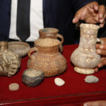 
              A collection of ancient pottery is displayed, as part of a cache of antiquities is returned to Libya from the United States on Thursday, March 31, 2022 ,Tripoli, Libya. The United States returned a cache of smuggled ancient artifacts to Libya on Thursday as the oil-rich Mediterranean country struggles to protect its ancient heritage against the backdrop of years of war, turmoil and unrest. (AP Photo/Yousef Murad).
            