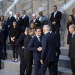 
              President Joe Biden, left, talks with French President Emmanuel Macron, as they arrive at NATO Headquarters in Brussels, Thursday, March 24, 2022, as Turkish President Recep Tayyip Erdogan, right, looks on. (Brendan Smialowski, Pool via AP)
            