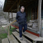
              Mike Weesner walks down the steps of a cabin he built that sits near Lick Creek on his property on March 8, 2022, in Primm Springs, Tenn. The Water Authority of nearby Dickson County has plans for a new water treatment plant that will use Lick Creek as a wastewater outflow for the plant. Residents of neighboring Hickman County worry that the new plant will destroy their pristine creek's aquatic life; contaminate wells, springs and crops; and increase flooding. The plant would discharge up to 12 million gallons per day into Lick Creek, which has a low flow of less than 9 million gallons per day. (AP Photo/Mark Humphrey)
            